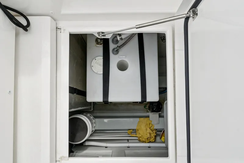 Slide: The Image of Storage compartment of 2025 Aquila 36 Cruiser, featuring equipment and supplies. - 61