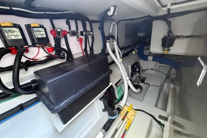 Slide: The Image of Electrical system inside 2025 Aquila 36 Cruiser boat, showcasing wiring and components. - 62