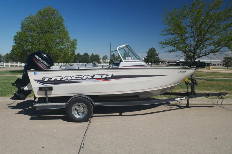 The Image of 2018 Tracker Pro Guide V-165 WT boat on trailer, parked outdoors. - 0