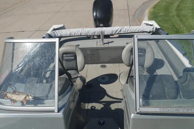 Slide: The Image of 2018 Tracker Pro Guide V-165 WT boat interior with seating and windshield. - 3