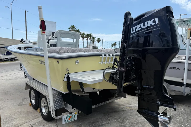 Slide: The Image of 2023 Exuma 22 boat with Suzuki outboard motor on trailer. - 3