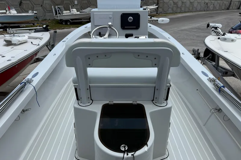 Slide: The Image of 2023 Exuma 22 boat interior with steering console and seating. - 5