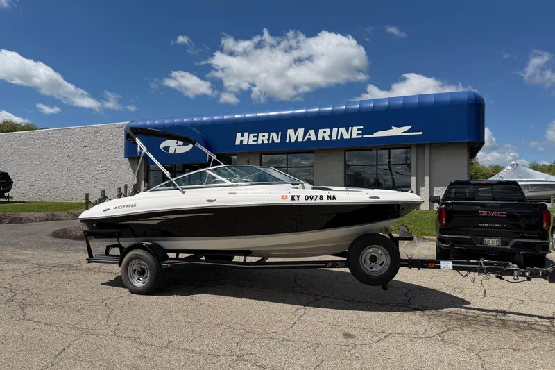 The Image of 2011 Four Winns H190 boat on trailer outside Hern Marine dealership. - 1