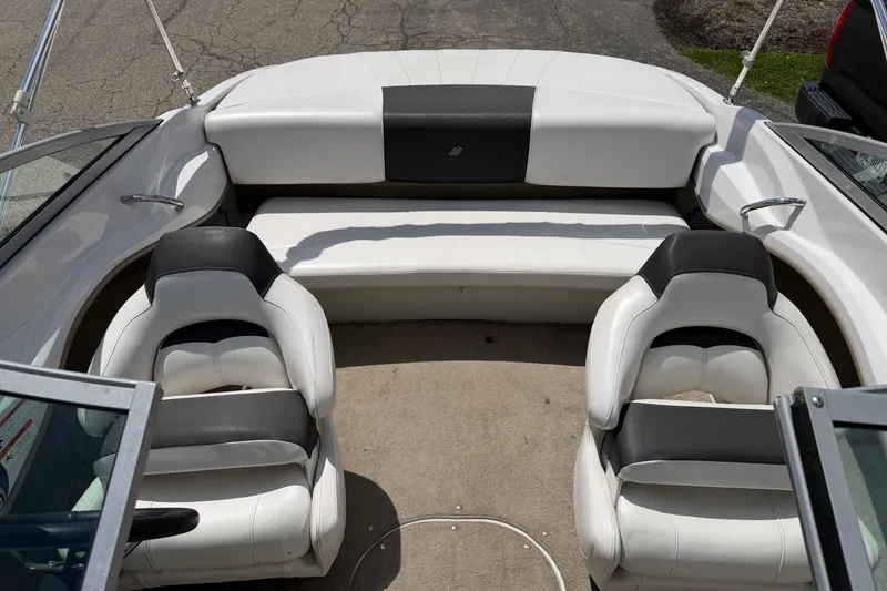 Slide: The Image of Interior of 2011 Four Winns H190 boat with white and black seating. - 10