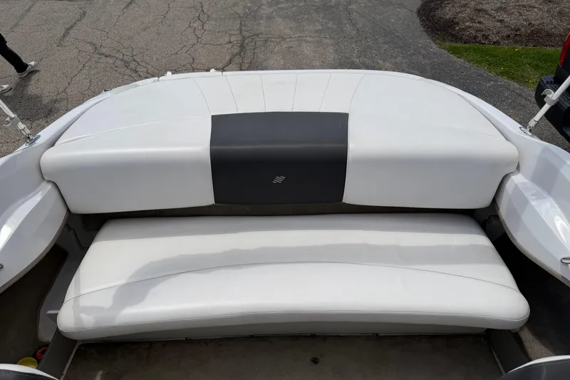 Slide: The Image of 2011 Four Winns H190 boat interior with white cushioned seating. - 5