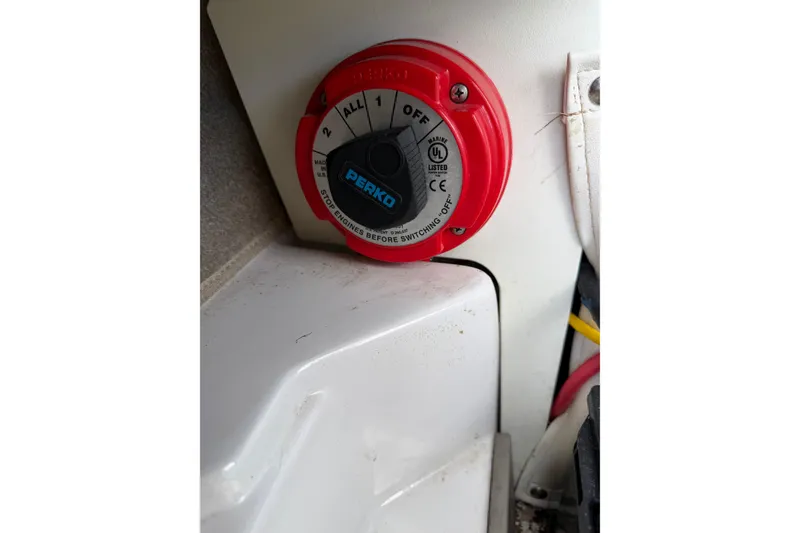 Slide: The Image of Battery switch on a 2011 Four Winns H190 boat, featuring a Perko dial. - 6