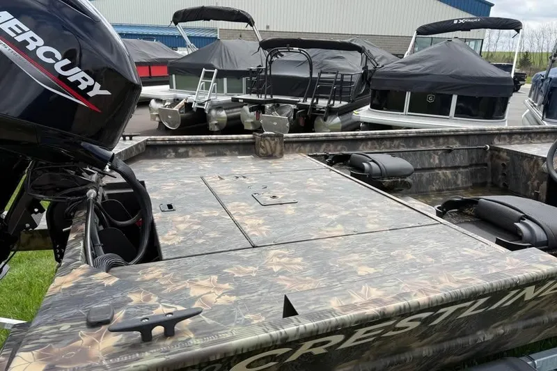Slide: The Image of 2021 Crestliner 1760 Retriever SC boat with camo design and Mercury outboard motor. - 12