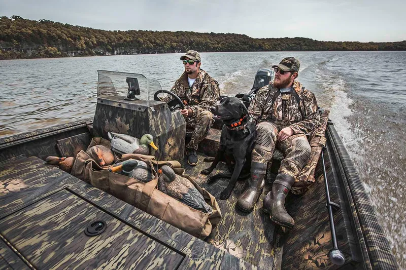 Slide: The Image of Manufacturer Provided Image: 2021 Crestliner 1760 Retriever SC boat with hunters and dog on a lake. - 18