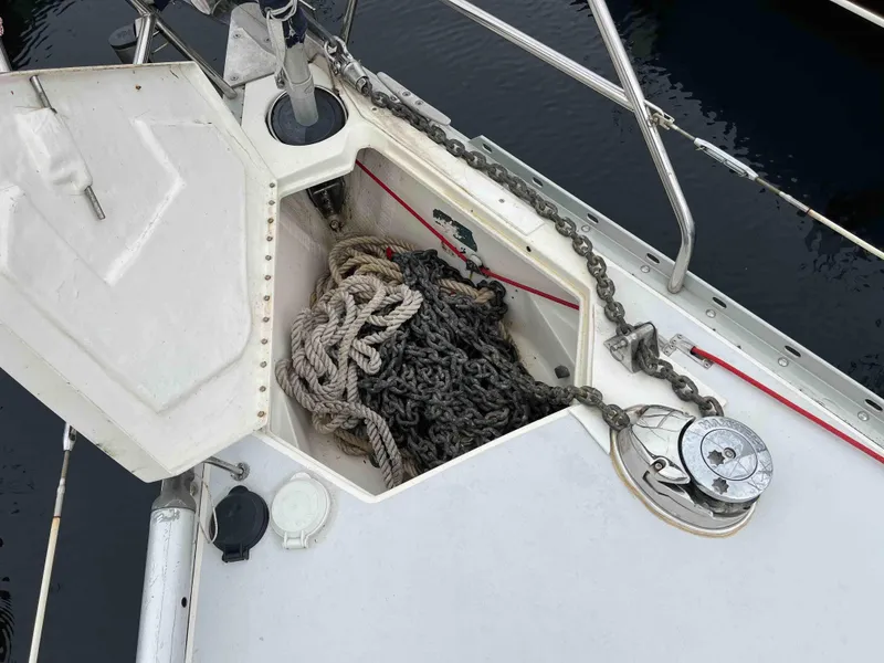 Slide: The Image of Anchor chain and rope storage on 1990 Hunter 37.5 sailboat deck. - 16