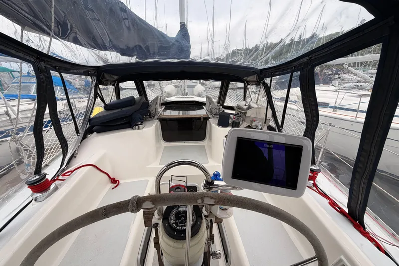 Slide: The Image of Cockpit view of a 1990 Hunter 37.5 sailboat with navigation equipment. - 24