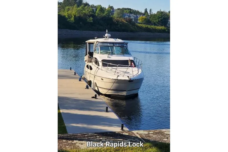 The Image of 2004 Cruisers Yachts 405 Express Motoryacht docked at Black Rapids Lock. - 0
