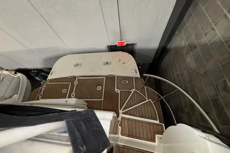 Slide: The Image of 2004 Cruisers Yachts 405 Express Motoryacht with wooden deck, viewed from above in storage. - 11