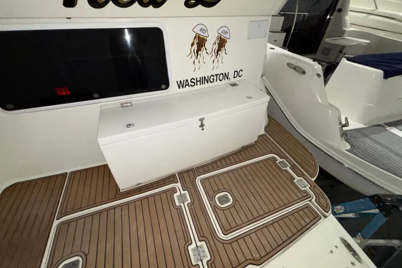 Slide: The Image of 2004 Cruisers Yachts 405 Express Motoryacht deck with storage, Washington, DC. - 12