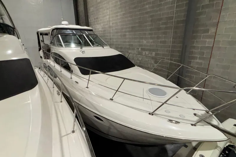 Slide: The Image of 2004 Cruisers Yachts 405 Express Motoryacht in storage, side view. - 2