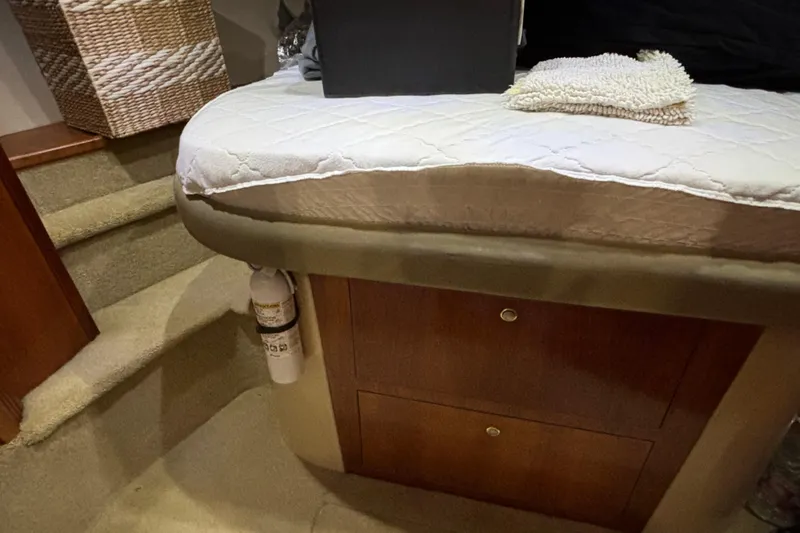 Slide: The Image of Interior of 2004 Cruisers Yachts 405 Express Motoryacht with bed, stairs, and storage. - 28