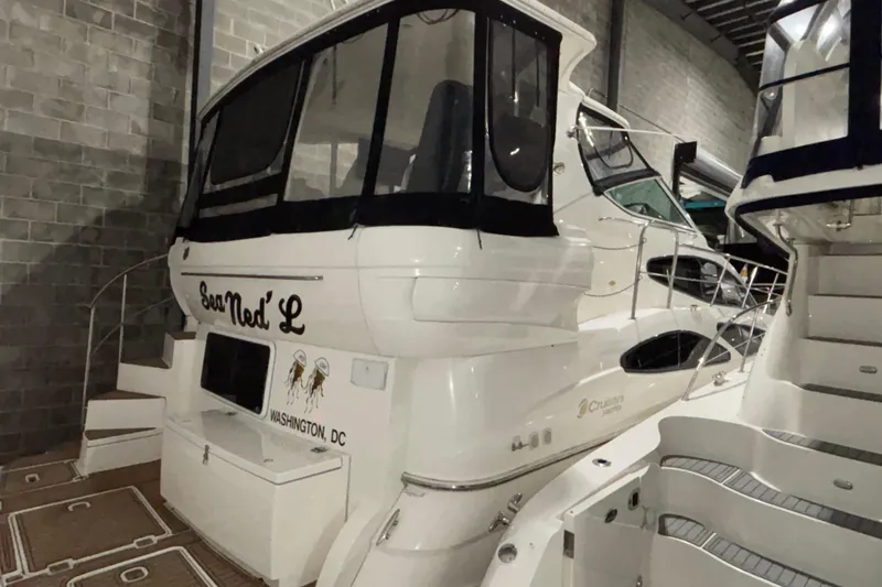 Slide: The Image of 2004 Cruisers Yachts 405 Express Motoryacht docked indoors, rear view. - 3