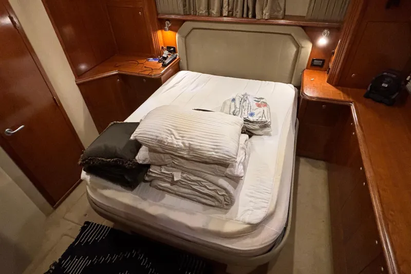 Slide: The Image of Luxurious bedroom interior of 2004 Cruisers Yachts 405 Express Motoryacht with neatly arranged bedding. - 38