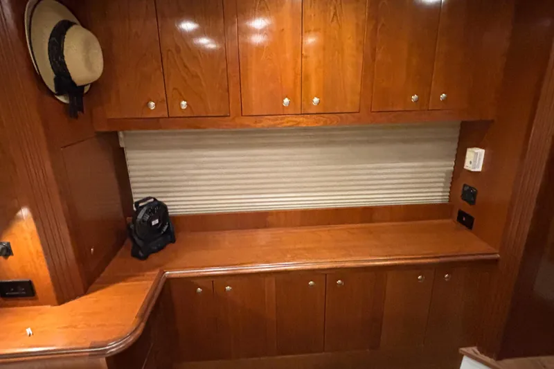 Slide: The Image of Luxurious wooden interior of 2004 Cruisers Yachts 405 Express Motoryacht with cabinets and decor. - 41