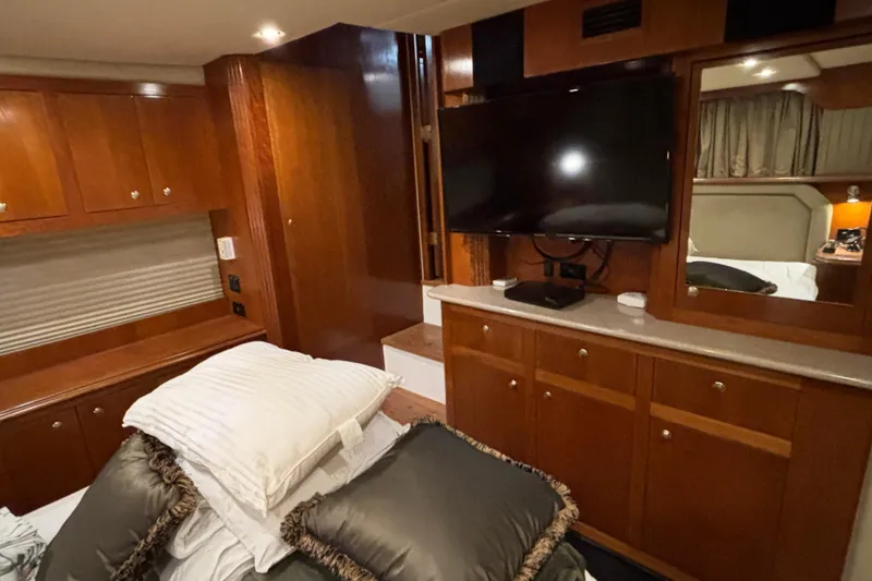 Slide: The Image of Luxurious interior of 2004 Cruisers Yachts 405 Express Motoryacht with wood cabinetry and TV. - 42