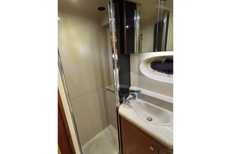 Slide: The Image of Luxurious bathroom in 2004 Cruisers Yachts 405 Express Motoryacht with shower and sink. - 43