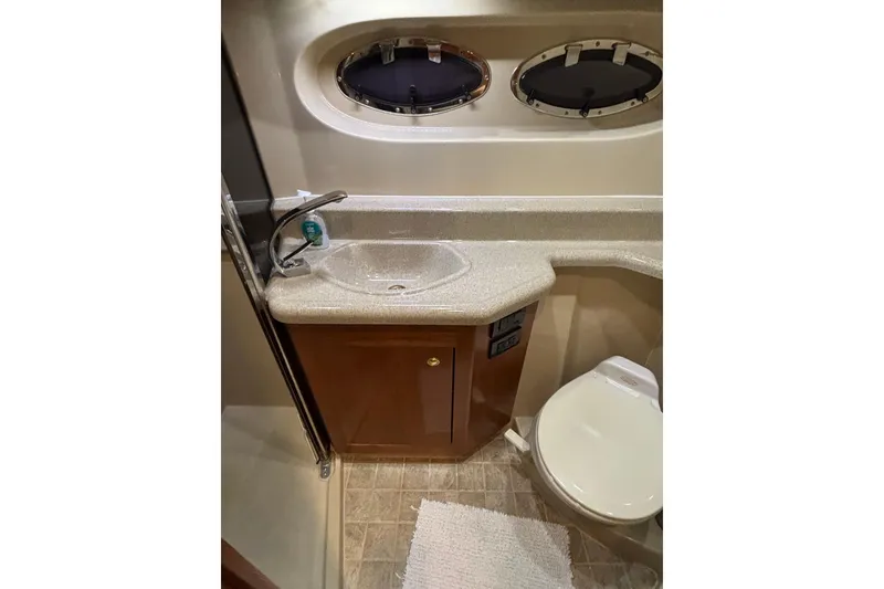 Slide: The Image of Luxurious bathroom in 2004 Cruisers Yachts 405 Express Motoryacht with sink and toilet. - 45