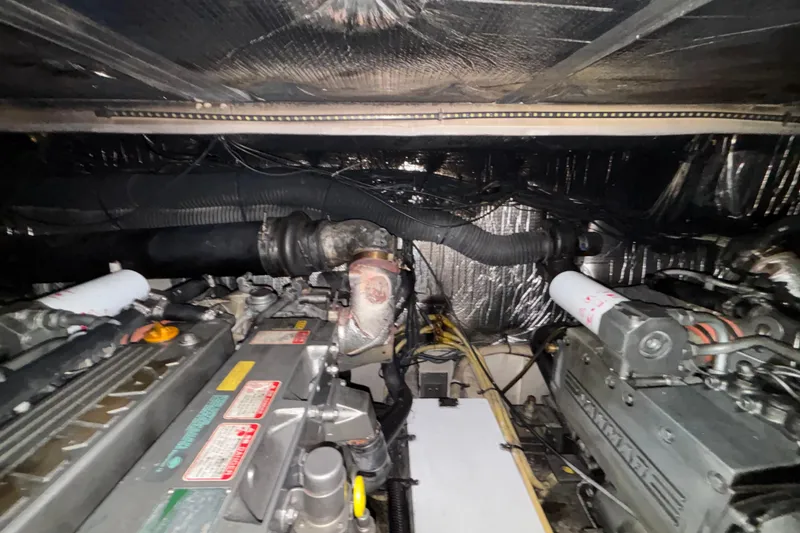 Slide: The Image of Engine room of 2004 Cruisers Yachts 405 Express Motoryacht, showcasing mechanical components. - 49