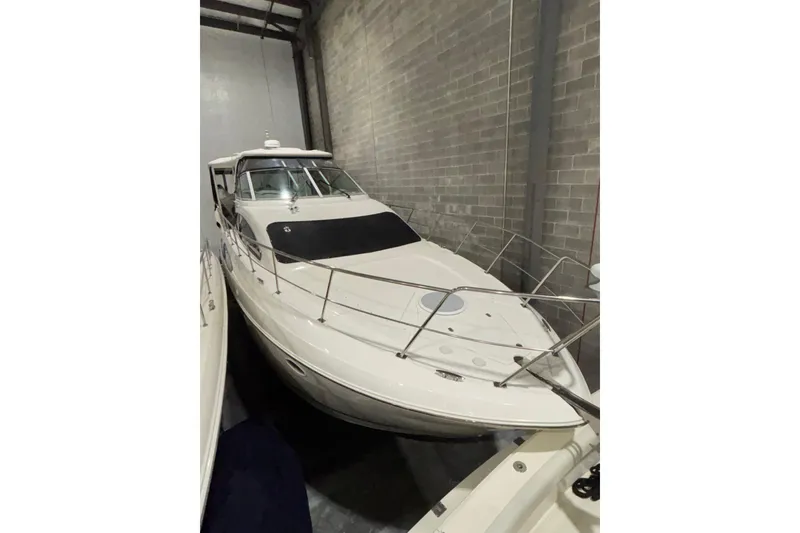 Slide: The Image of 2004 Cruisers Yachts 405 Express Motoryacht in storage, side view. - 5