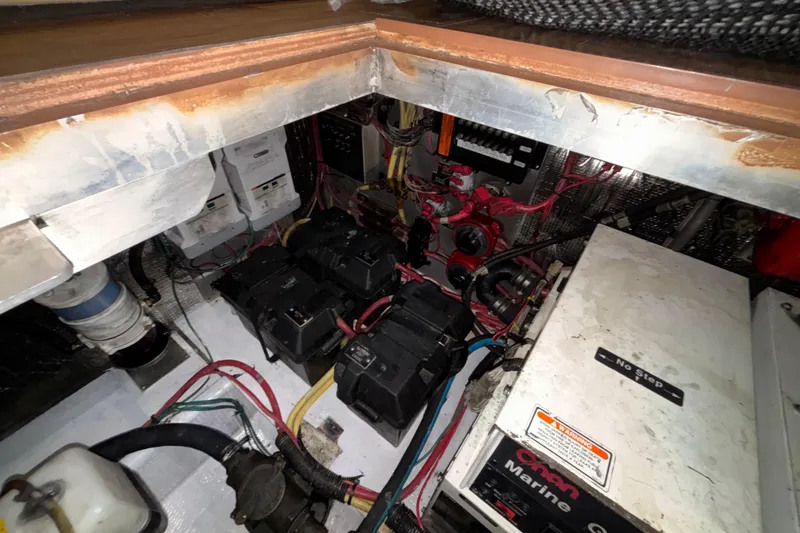 Slide: The Image of Engine room of 2004 Cruisers Yachts 405 Express Motoryacht with batteries and wiring. - 51