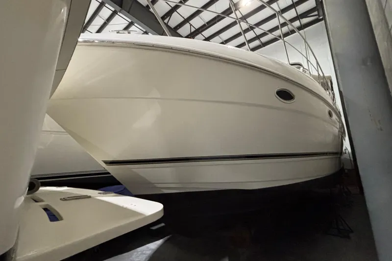 Slide: The Image of 2004 Cruisers Yachts 405 Express Motoryacht in storage, side view. - 6