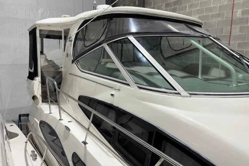 Slide: The Image of 2004 Cruisers Yachts 405 Express Motoryacht in storage, showcasing sleek design and spacious cabin. - 7