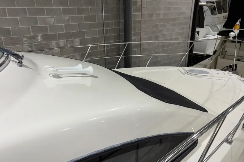 Slide: The Image of 2004 Cruisers Yachts 405 Express Motoryacht deck with horn and railing. - 8