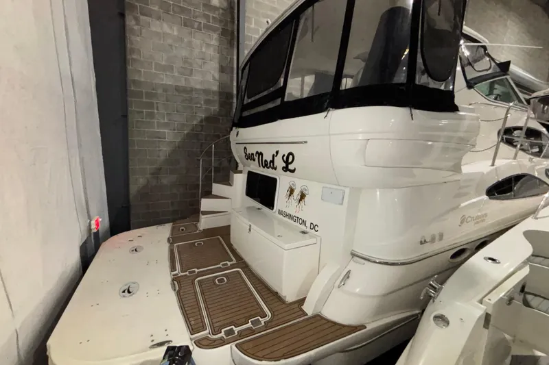 Slide: The Image of 2004 Cruisers Yachts 405 Express Motoryacht docked indoors, rear view. - 9