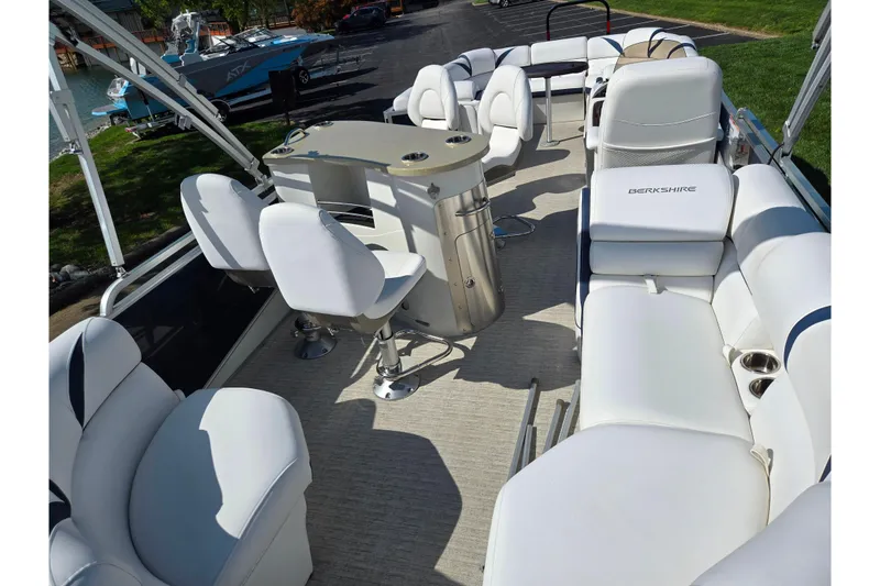 Slide: The Image of 2018 Berkshire 25E STS Entertainment pontoon boat with luxurious white seating and sleek design. - 11