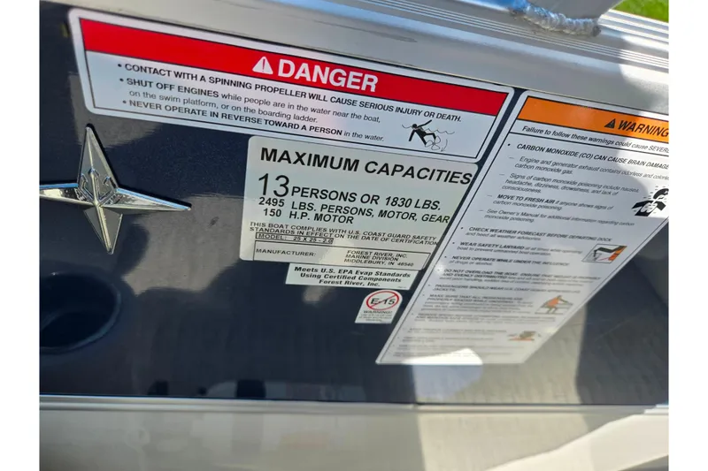 Slide: The Image of 2018 Berkshire 25E STS Entertainment boat capacity and safety warning labels. - 17
