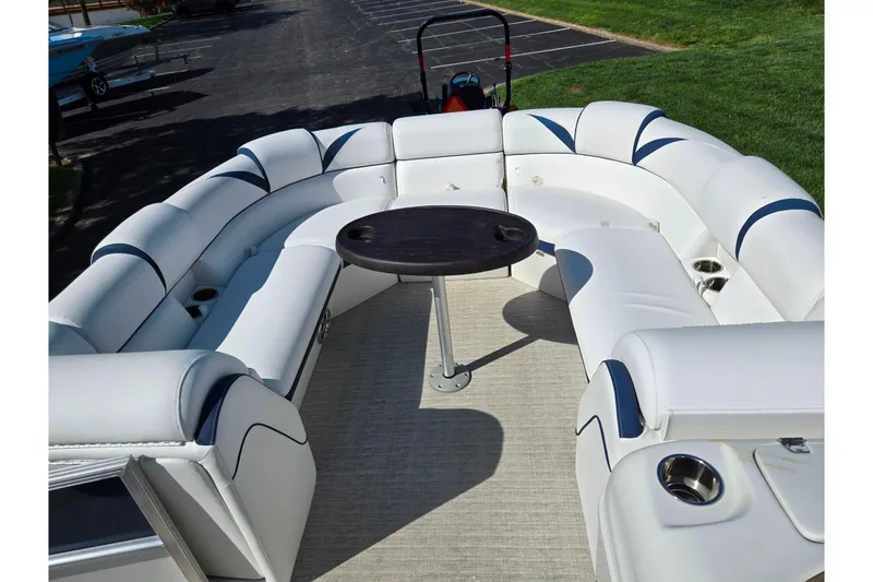 Slide: The Image of 2018 Berkshire 25E STS Entertainment pontoon boat with spacious seating and central table. - 18