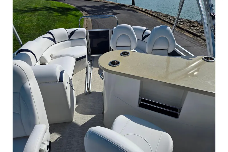 Slide: The Image of 2018 Berkshire 25E STS Entertainment pontoon boat interior with luxurious seating and bar area. - 24