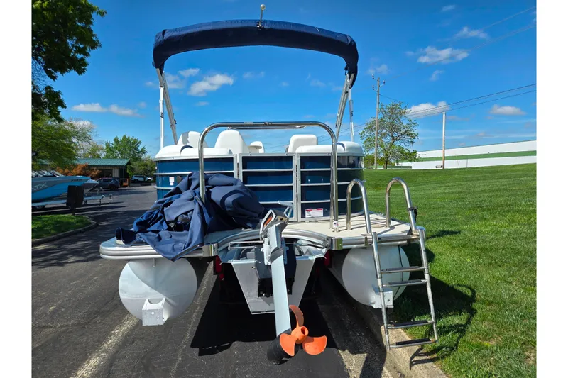 Slide: The Image of 2018 Berkshire 25E STS Entertainment pontoon boat with canopy and ladder on a sunny day. - 3