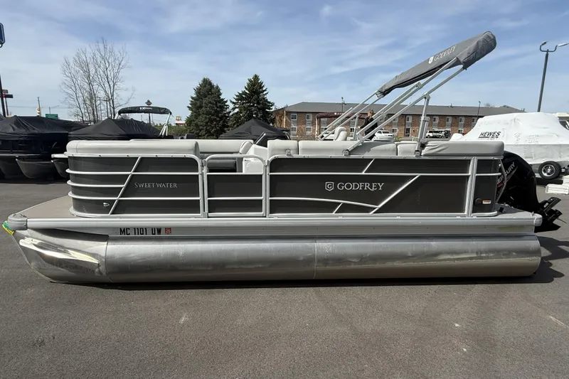The Image of 2022 Godfrey Sweetwater 2086 C pontoon boat parked on pavement. - 0