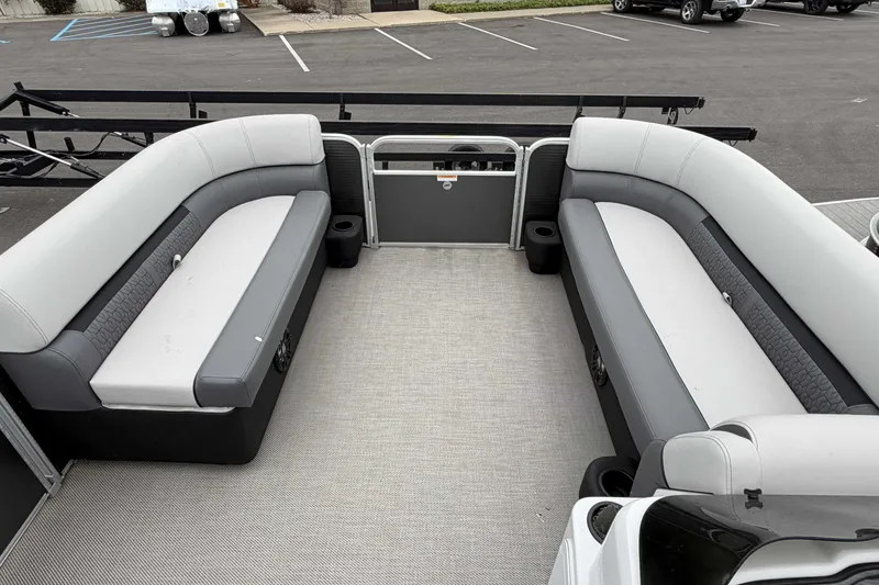 Slide: The Image of 2022 Godfrey Sweetwater 2086 C pontoon boat interior with gray seating and carpeted floor. - 13