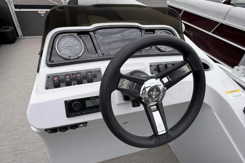 Slide: The Image of Steering console of 2022 Godfrey Sweetwater 2086 C pontoon boat with gauges and controls. - 16