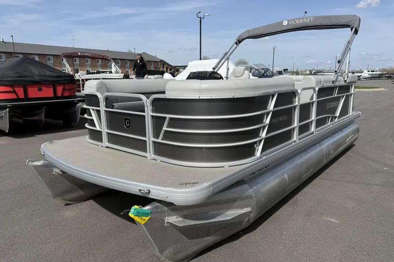 Slide: The Image of 2022 Godfrey Sweetwater 2086 C pontoon boat with canopy, parked outdoors. - 3