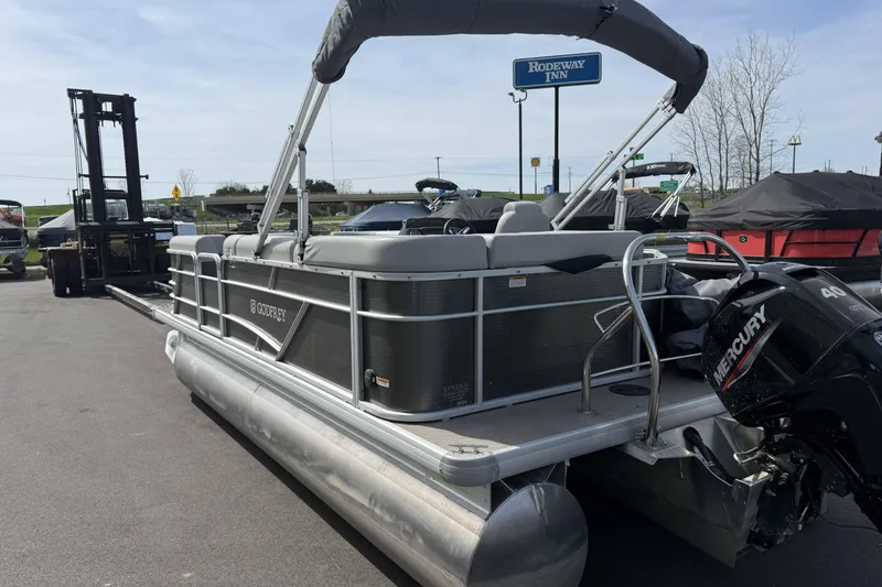 Slide: The Image of 2022 Godfrey Sweetwater 2086 C pontoon boat with Mercury engine, parked near Rodeway Inn. - 5