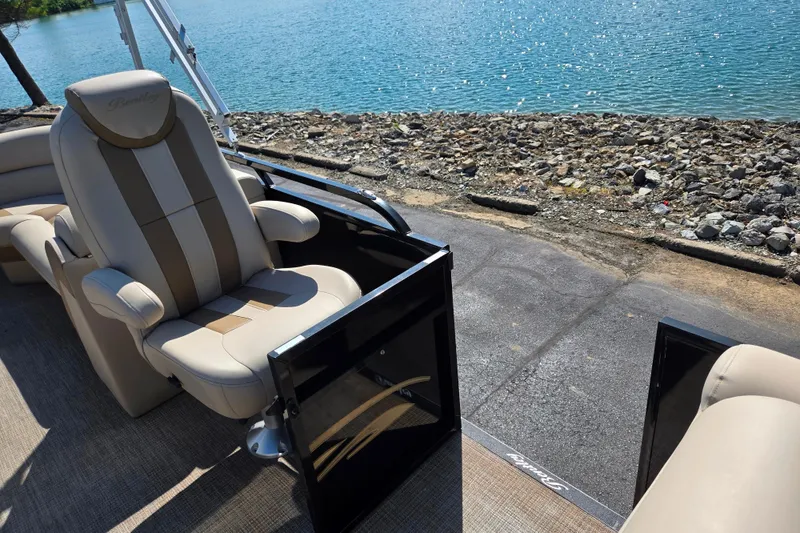 Slide: The Image of 2017 Bentley Pontoons 220 Elite Admiral interior with luxurious seating by the water. - 12