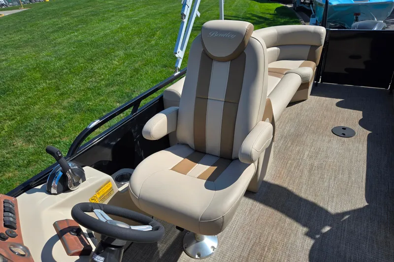 Slide: The Image of Luxurious interior of 2017 Bentley Pontoons 220 Elite Admiral with plush seating and steering console. - 13