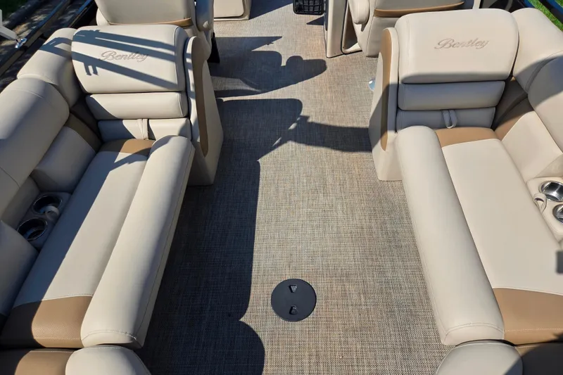 Slide: The Image of 2017 Bentley Pontoons 220 Elite Admiral interior with beige seating and cup holders. - 17