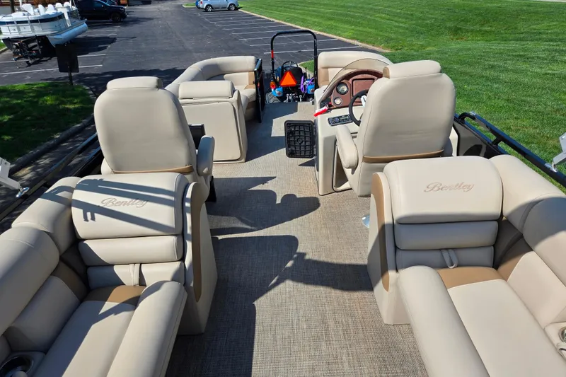 Slide: The Image of 2017 Bentley Pontoons 220 Elite Admiral interior with luxurious seating and steering console. - 18