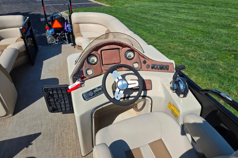 Slide: The Image of 2017 Bentley Pontoons 220 Elite Admiral dashboard with steering wheel and controls. - 19
