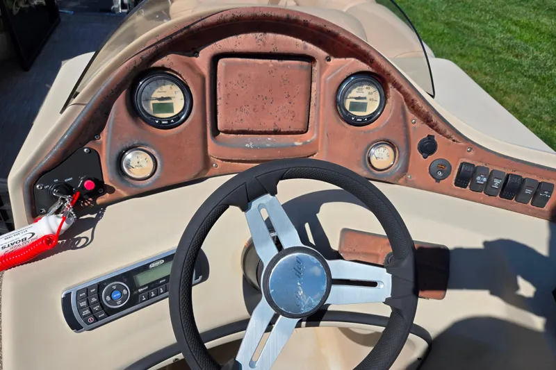 Slide: The Image of Steering console of 2017 Bentley Pontoons 220 Elite Admiral with gauges and controls. - 20