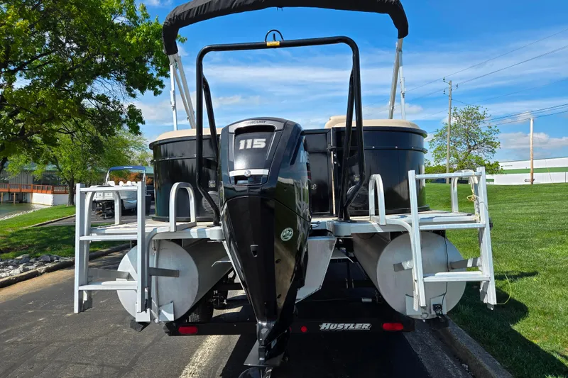 Slide: The Image of 2017 Bentley Pontoons 220 Elite Admiral with Mercury 115 engine on trailer, parked outdoors. - 3