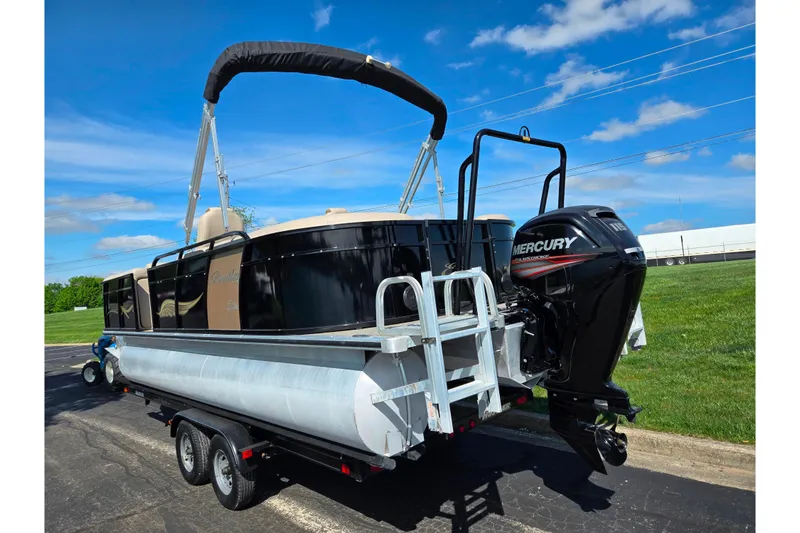 Slide: The Image of 2017 Bentley Pontoons 220 Elite Admiral with Mercury outboard motor on trailer. - 4